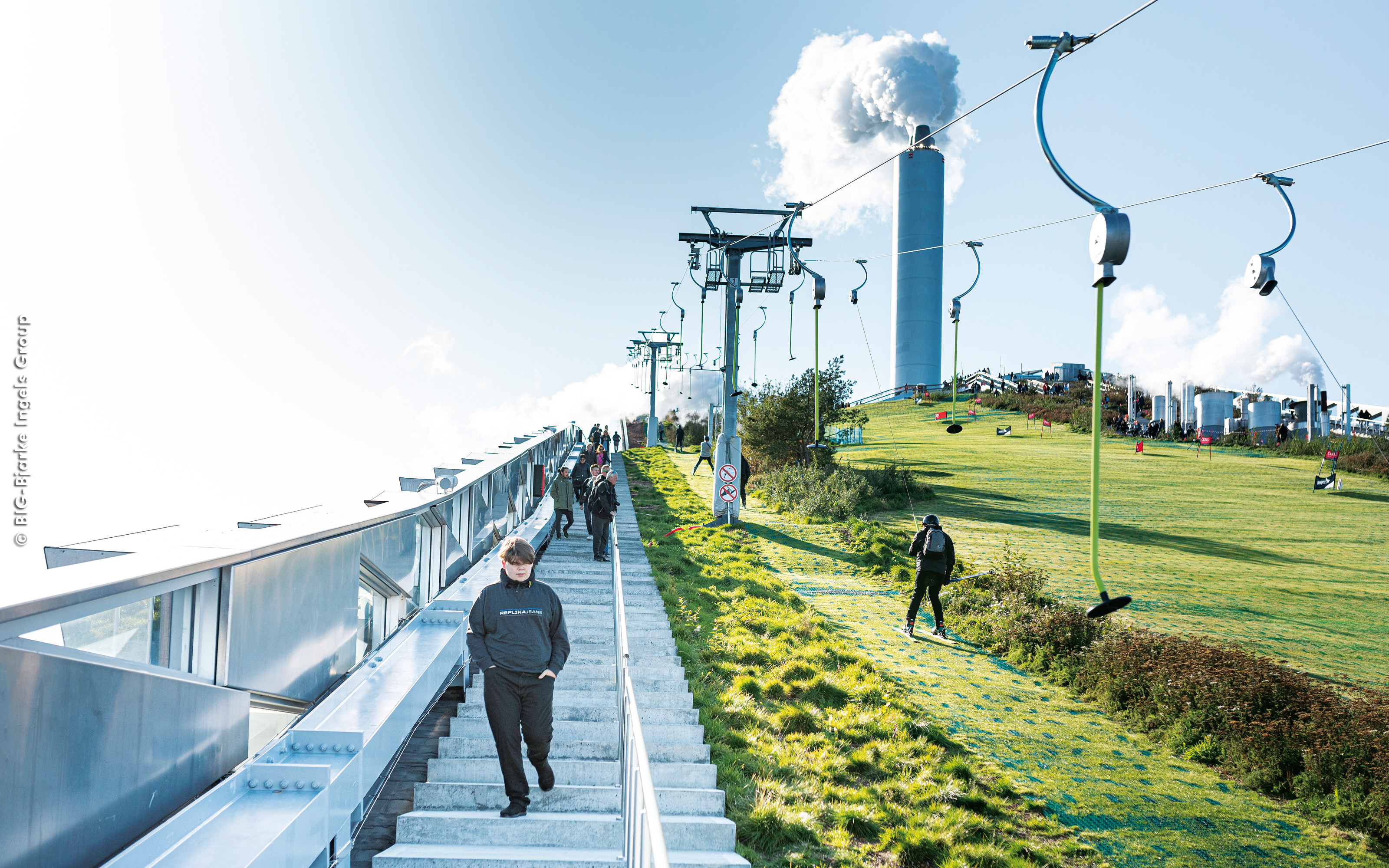 The roof also accommodates a 450 m vegetated long ski slope. Pitched green roof with stairs, lawn and a vegetated ski slope